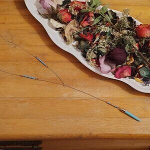 Fine gold drip chain necklace with turquois point